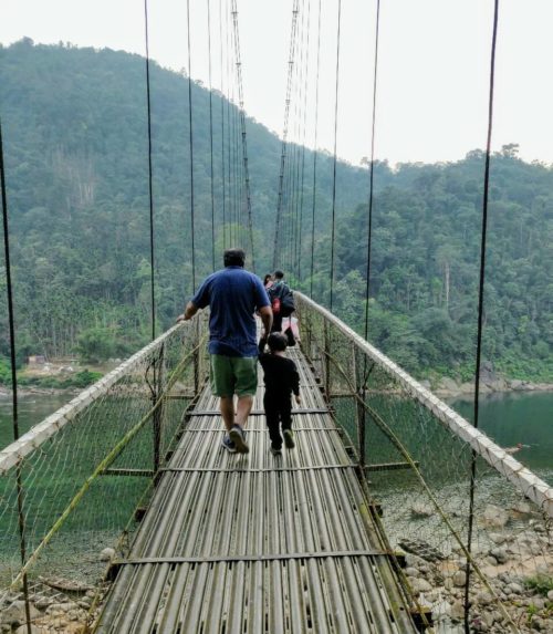 Crossing the suspension bridge over Umgnot river