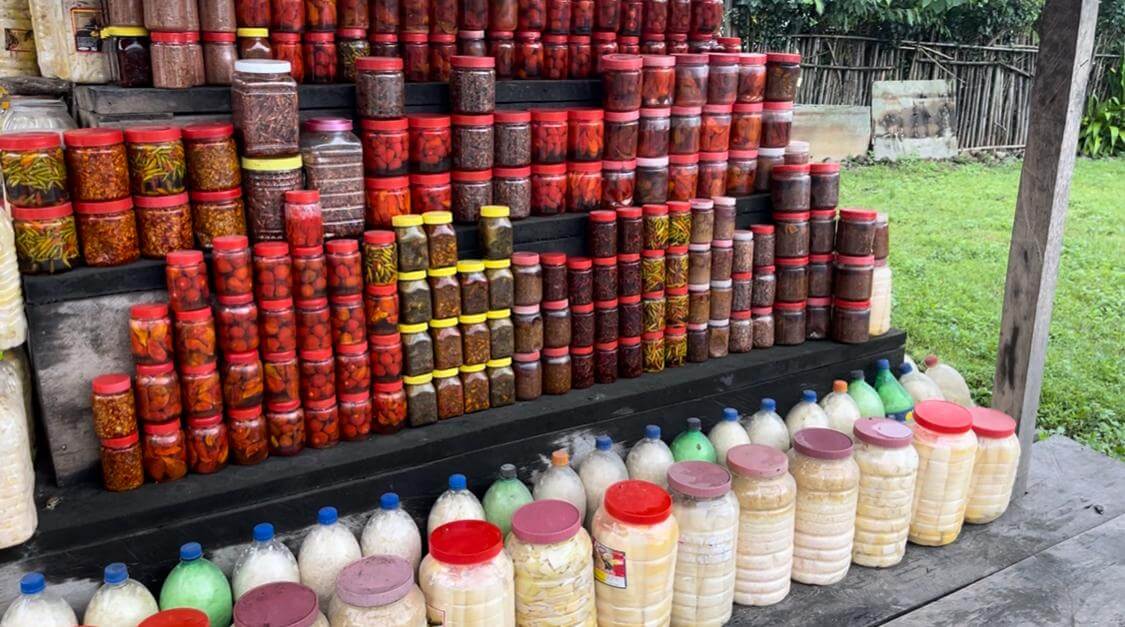 A tangy and spicy traditional pickle made with bamboo shoots, local spices, and oil. Usually served as a side.