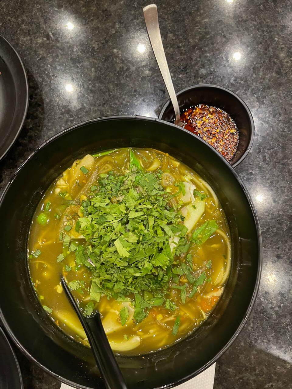 A hearty Tibetan noodle soup made with vegetables, herbs, and a mild broth.